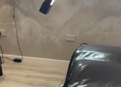 Modern treatment room at lashesbydc in Leeds, England, GB featuring comfy bed and stylish lighting.