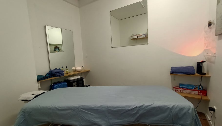 Relaxing massage room setup at Massage Guys (South Auckland), Auckland, NZ with soothing decor and amenities.