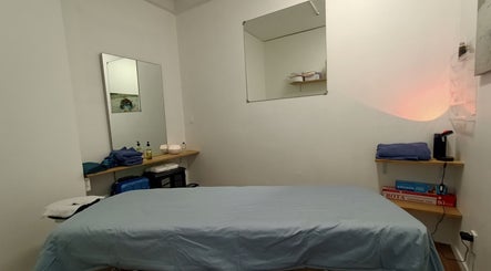 Relaxing massage room setup at Massage Guys (South Auckland), Auckland, NZ with soothing decor and amenities.