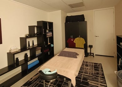 Calm massage room at Massage Guys (South Auckland), Auckland, Auckland, NZ with elegant decor and a massage table.