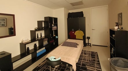 Calm massage room at Massage Guys (South Auckland), Auckland, Auckland, NZ with elegant decor and a massage table.