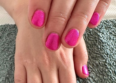 Elegant pink nails at Sun Kissed Nail & Wax Studio in Thurso, Scotland, GB showcasing flawless manicure.