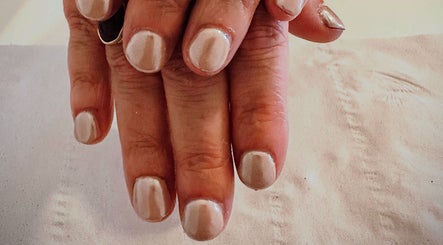 Manicured nails with shimmering polish at Sun Kissed Nail & Wax Studio, Thurso, Scotland, GB.