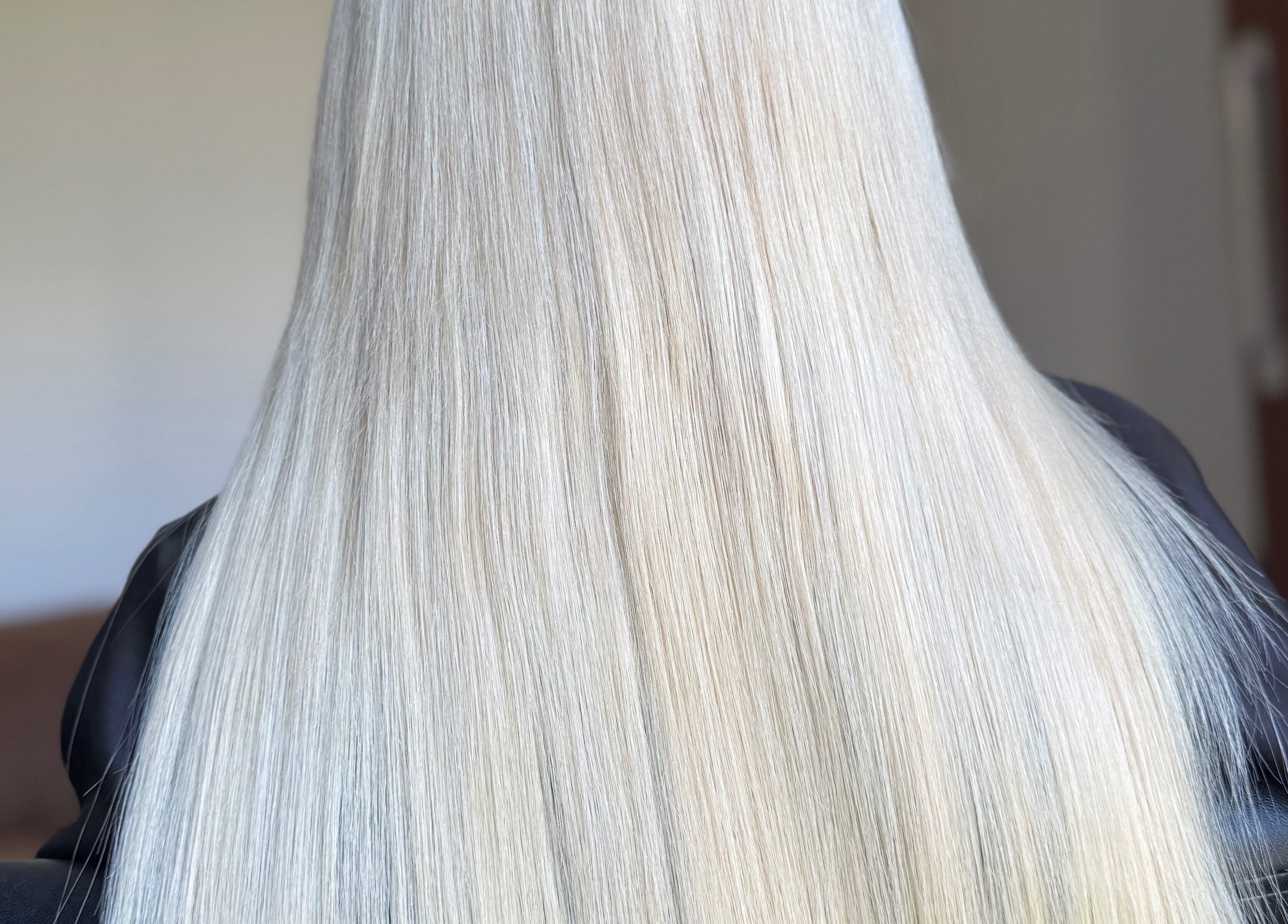Silky blonde hair styled at Hairbypheebs, Nirimba, Queensland, AU, showcasing smooth elegance.