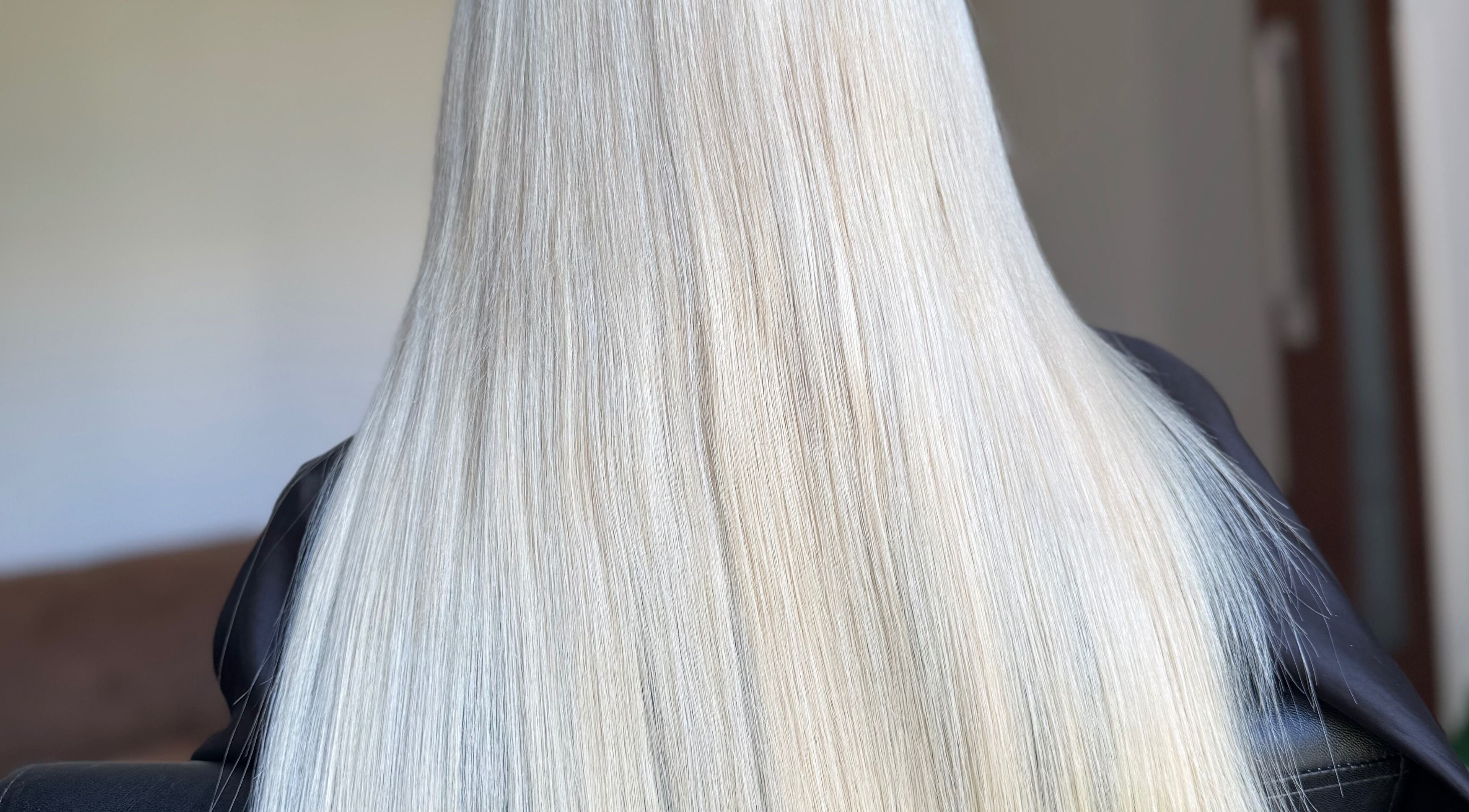 Silky blonde hair styled at Hairbypheebs, Nirimba, Queensland, AU, showcasing smooth elegance.