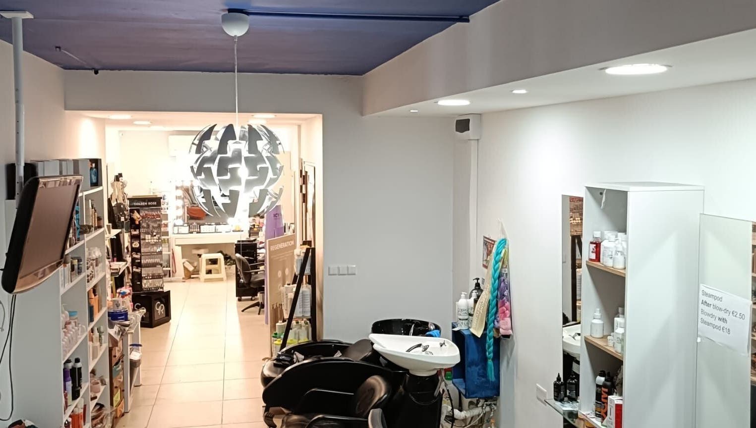 Modern salon interior at Hairlux by Naomi, Ħal Safi, MT with chic decor and styling stations.