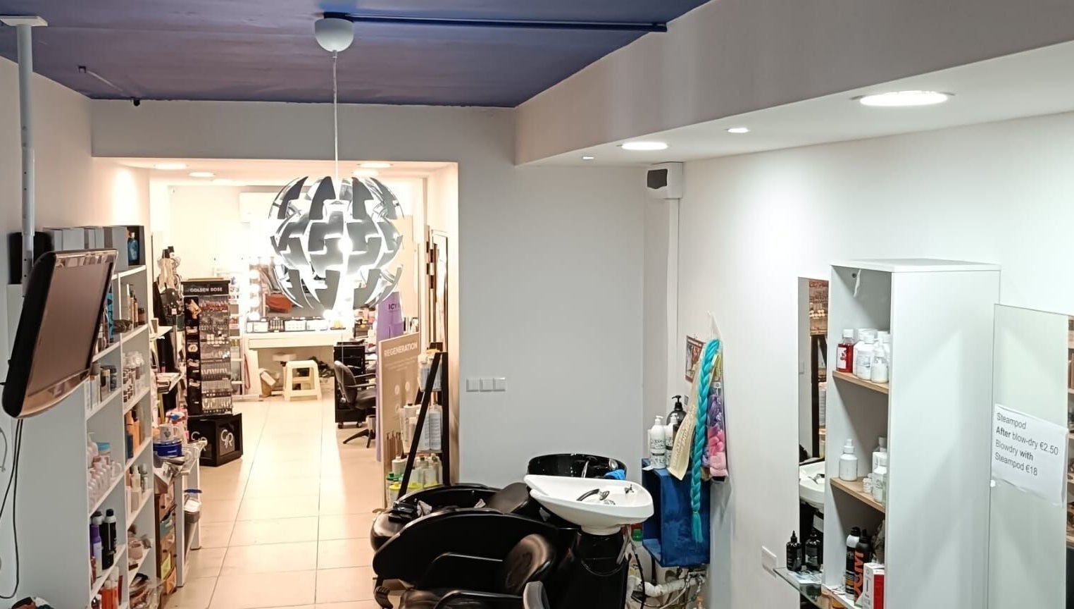 Modern salon interior at Hairlux by Naomi, Ħal Safi, MT with chic decor and styling stations.