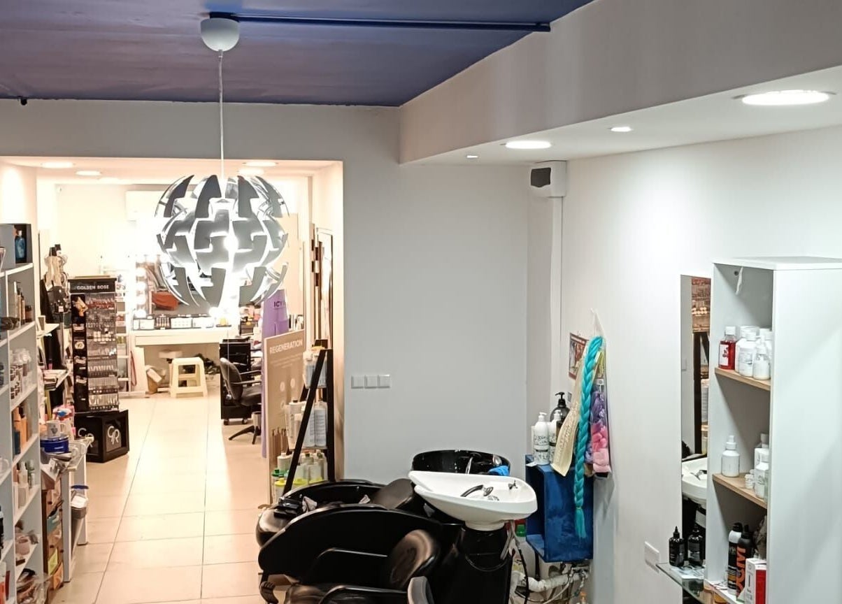 Modern salon interior at Hairlux by Naomi, Ħal Safi, MT with chic decor and styling stations.