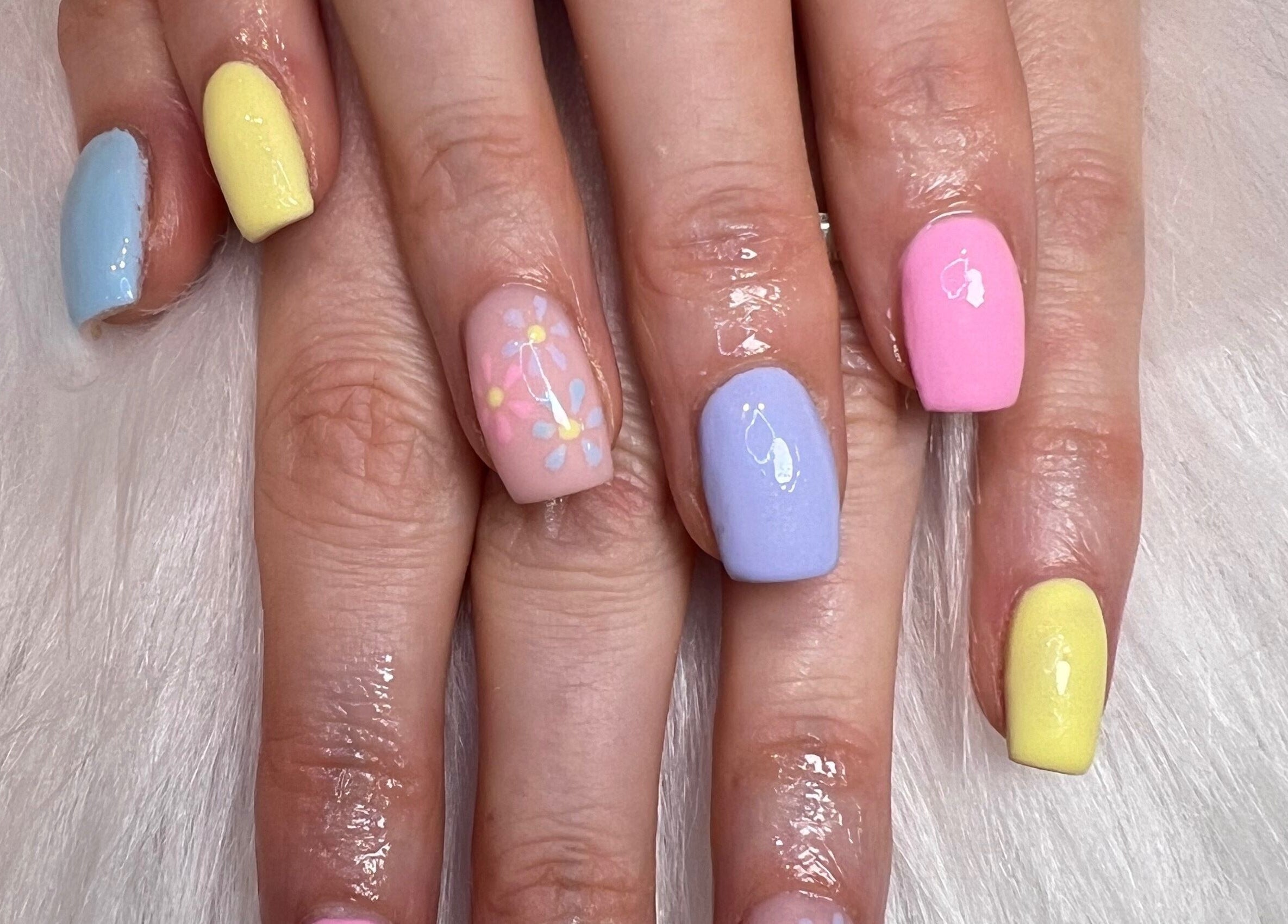 Colorful pastel nails with floral design at The Glitter Garage, Halifax, England, GB.