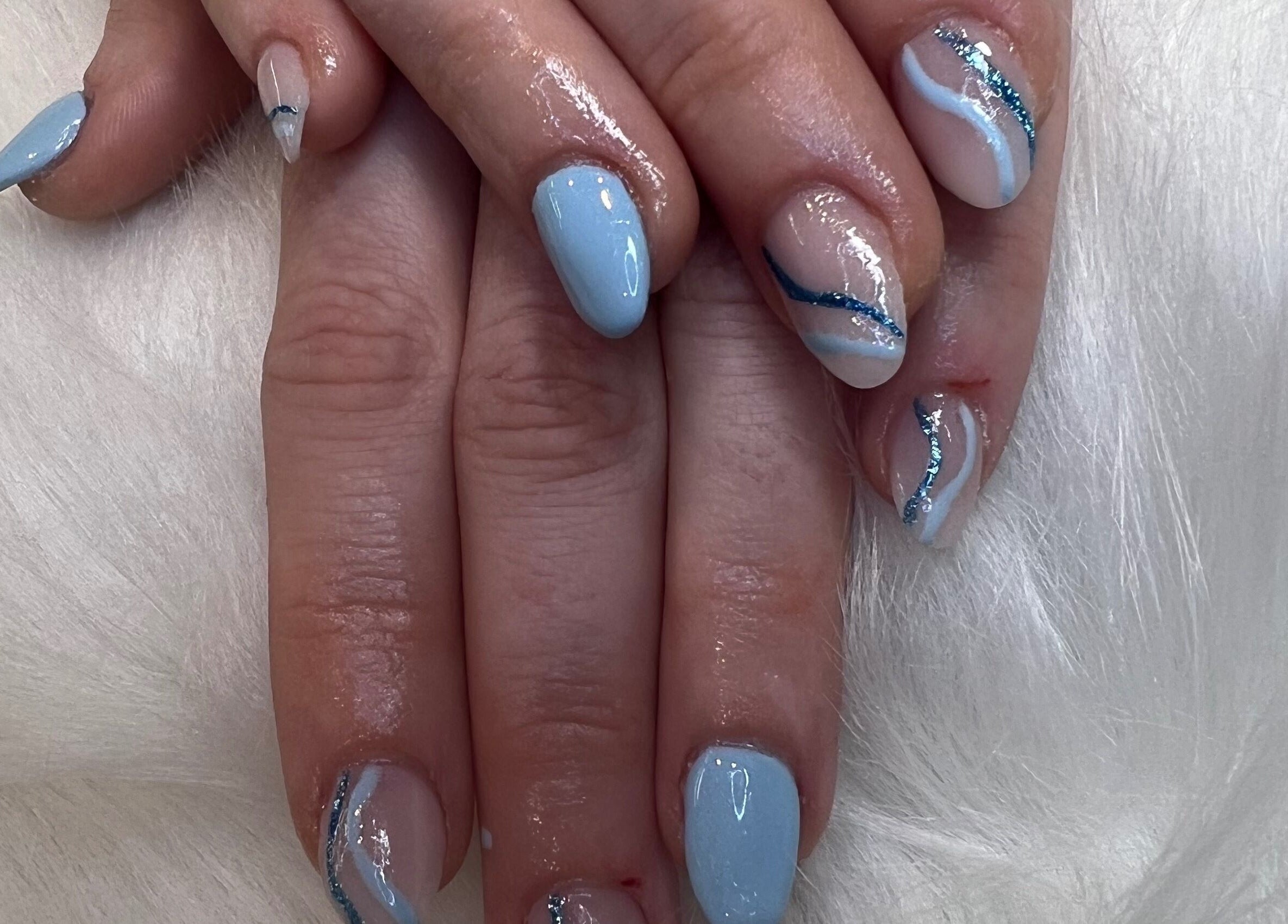 Elegant blue and white nail art at The Glitter Garage, Halifax, England, GB.