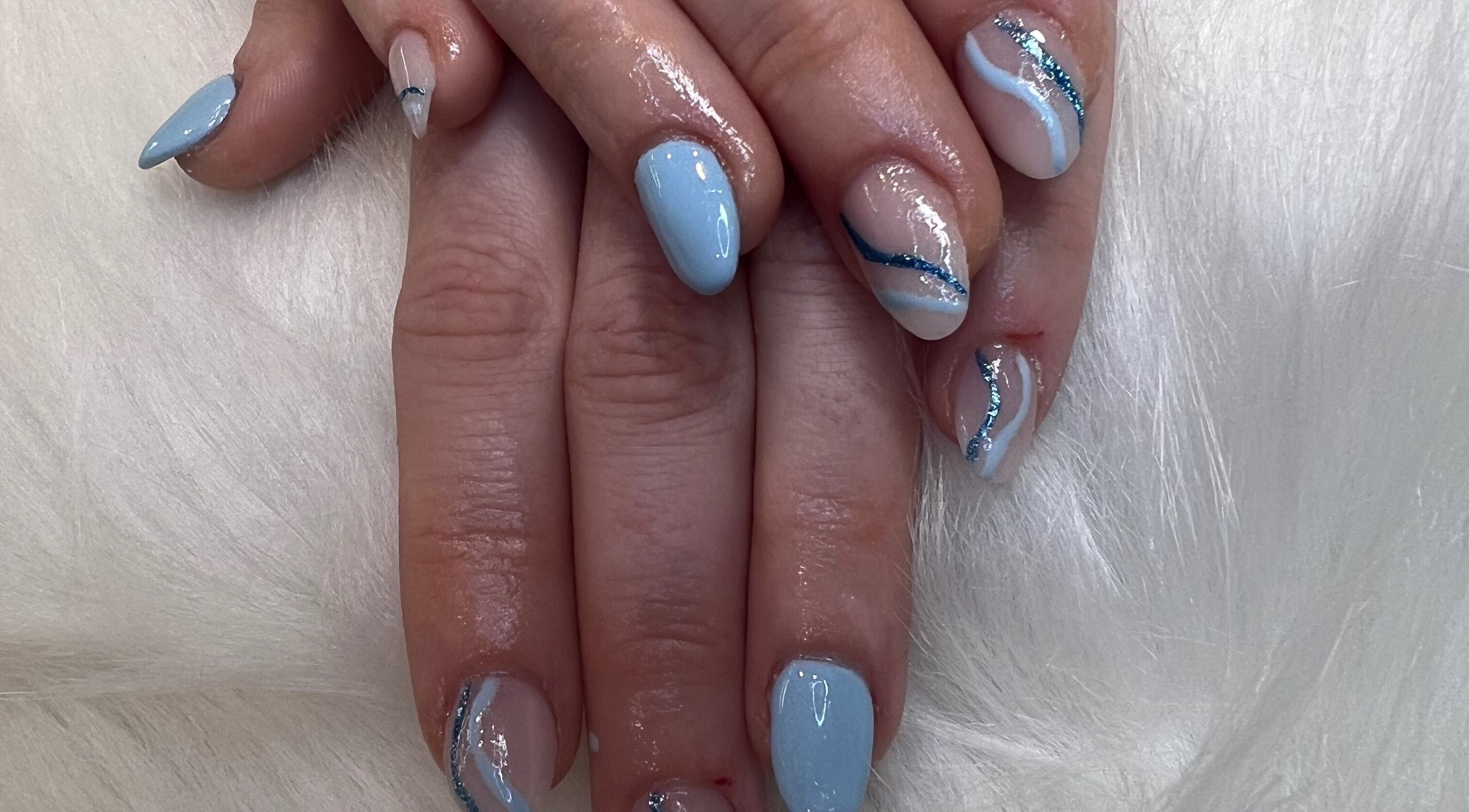 Elegant blue and white nail art at The Glitter Garage, Halifax, England, GB.