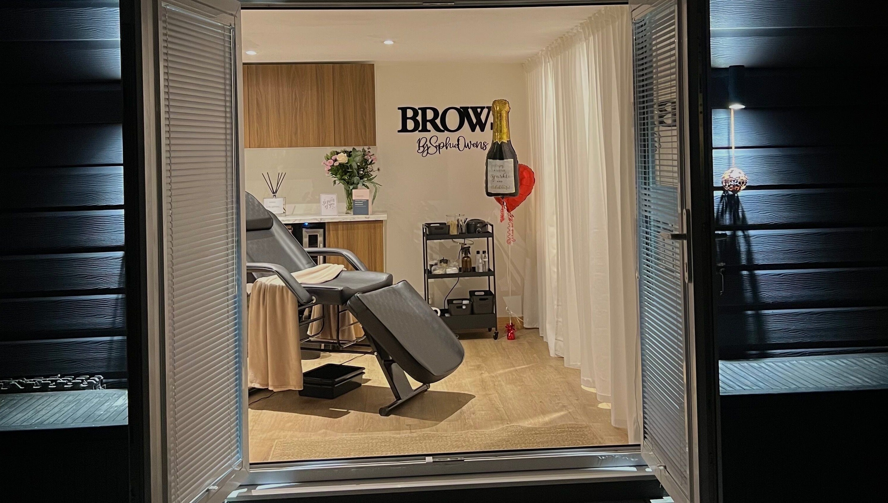 Elegant treatment room at Sophz Browz, Barry, Wales, GB, showcasing a plush chair and serene decor.