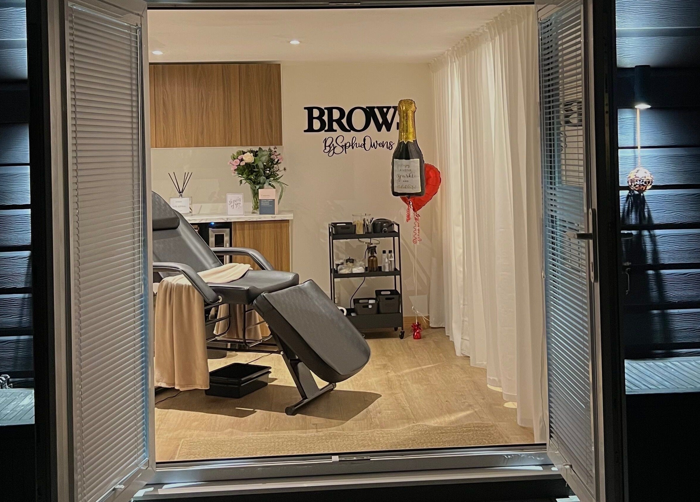 Elegant treatment room at Sophz Browz, Barry, Wales, GB, showcasing a plush chair and serene decor.