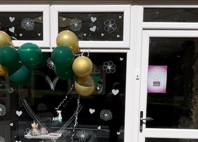 Entrance of Tilly Rose Nails at The Beauty Lounge, decorated with balloons, Newcastle-under-Lyme, England, GB.