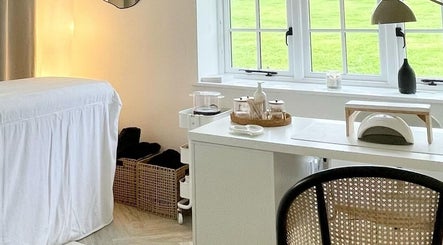 Relaxing treatment room at The Lookery Beauty Room, Milton Keynes, England. Bright, serene, and inviting space.