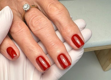 Red polished nails from The Lookery Beauty Room in Milton Keynes, England, GB.