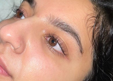 Close-up of a polished face with smooth skin at The Lookery Beauty Room, Milton Keynes, England, GB.