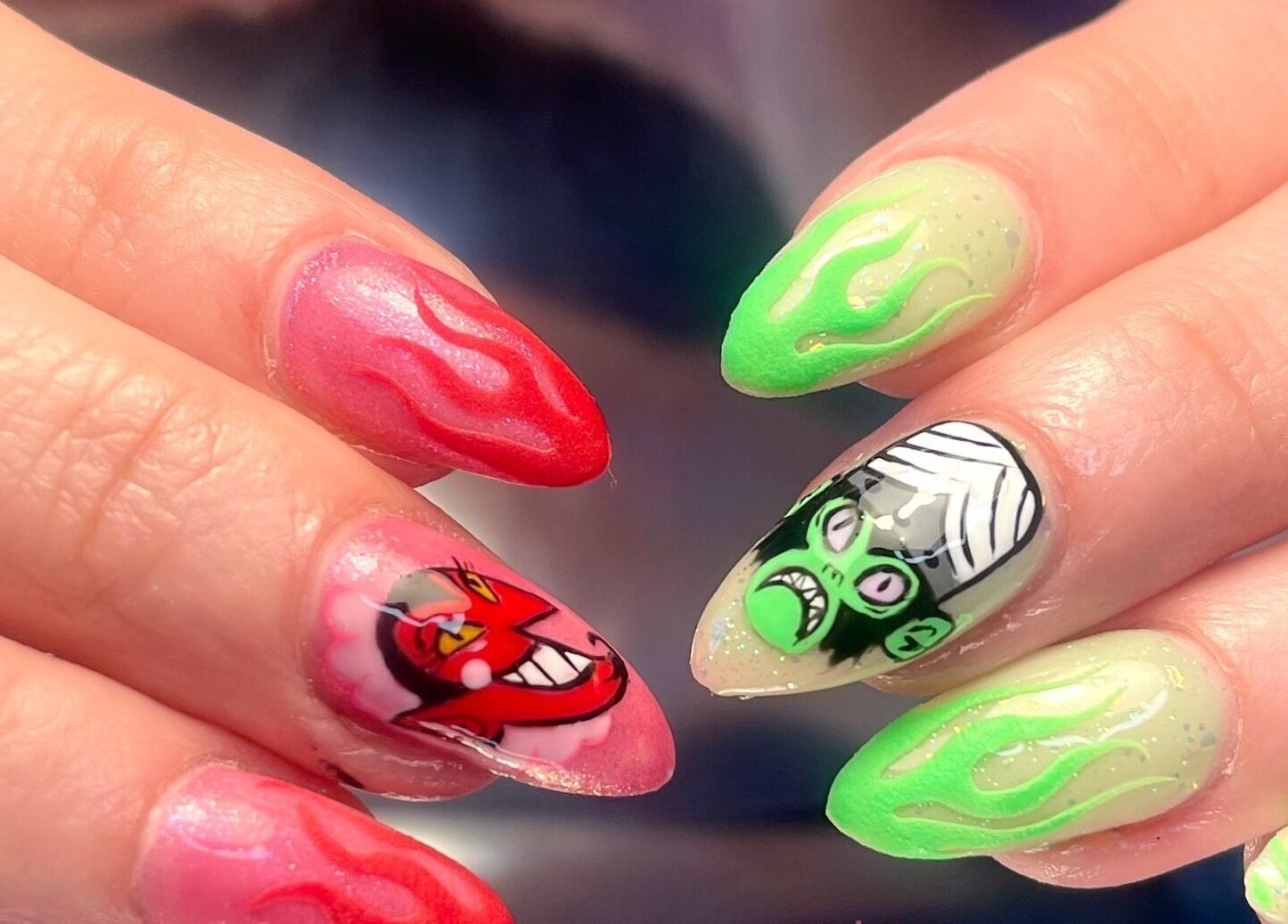 Vibrant nail art featuring red and green designs at Get Nailed by Molly, Liverpool, England, GB.