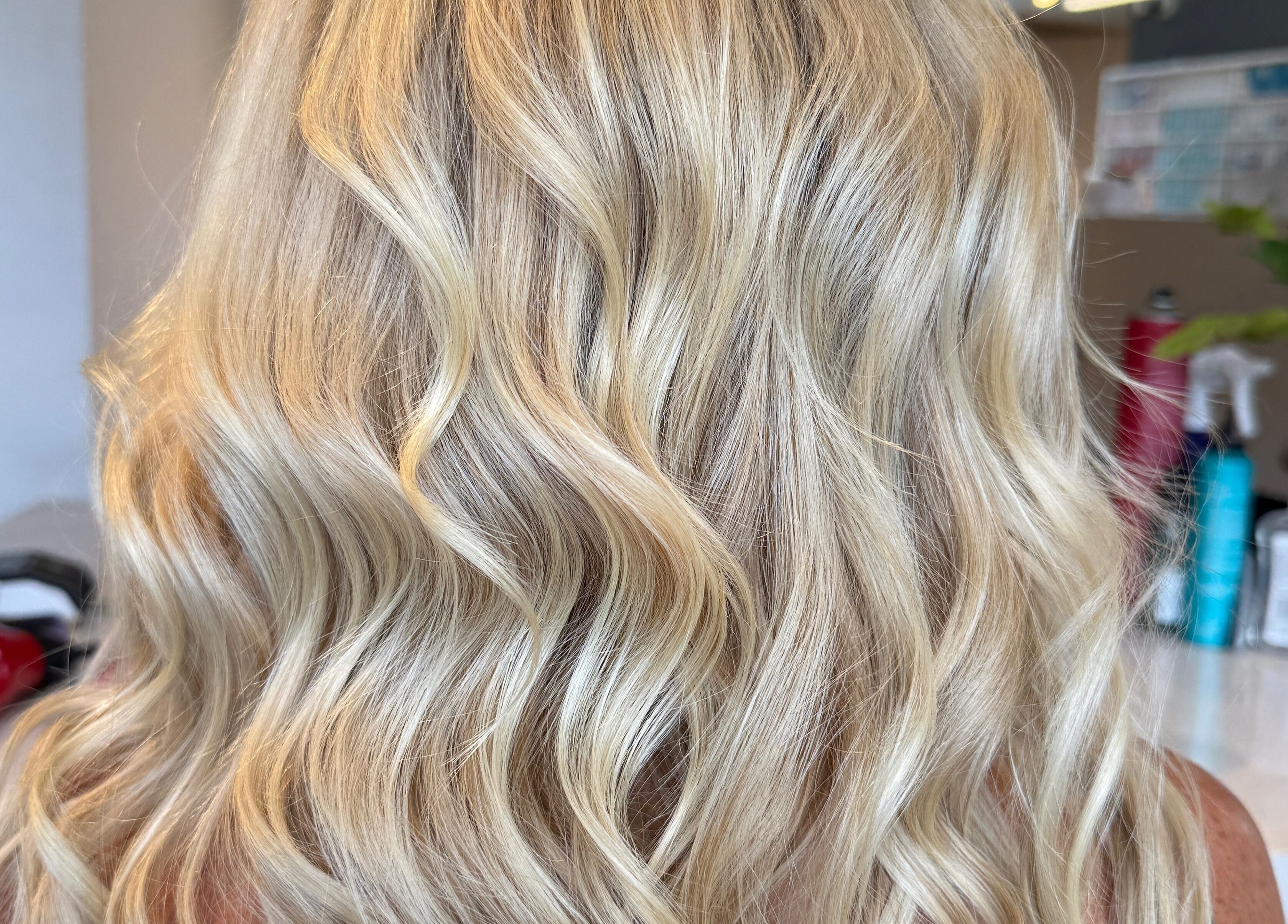 Elegant blonde waves styled at Hair By Kisha at Hairsalon Faraday, located in Auckland, Auckland, NZ.
