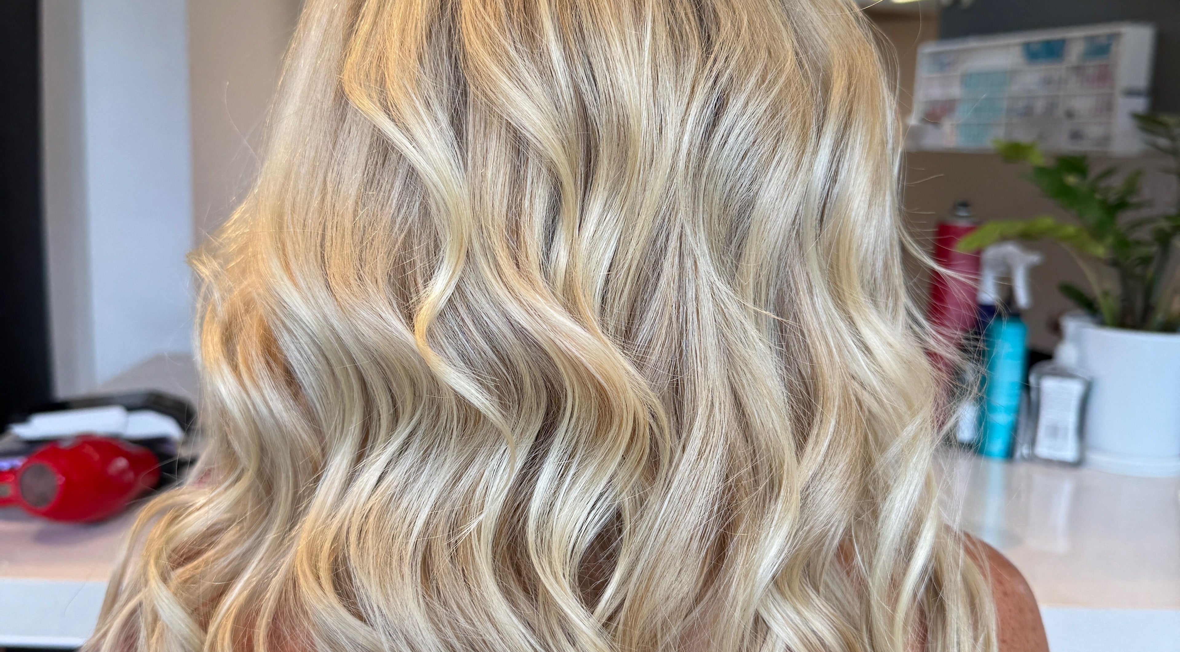 Elegant blonde waves styled at Hair By Kisha at Hairsalon Faraday, located in Auckland, Auckland, NZ.