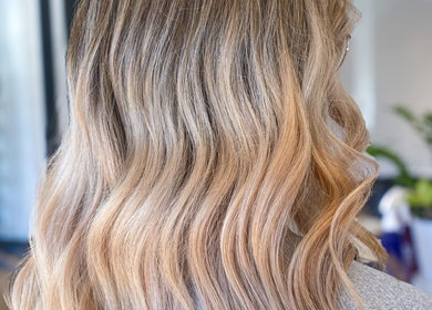 Blonde curls styled at Hair By Kisha at Wairau HairDesign, Auckland, Auckland, NZ. Elegant salon look.