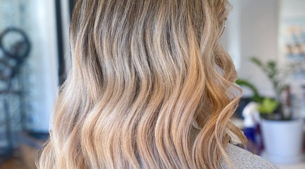 Blonde curls styled at Hair By Kisha at Wairau HairDesign, Auckland, Auckland, NZ. Elegant salon look.