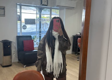 Woman in a chic outfit at Hair By Kisha at Wairau HairDesign, Auckland, Auckland, NZ.