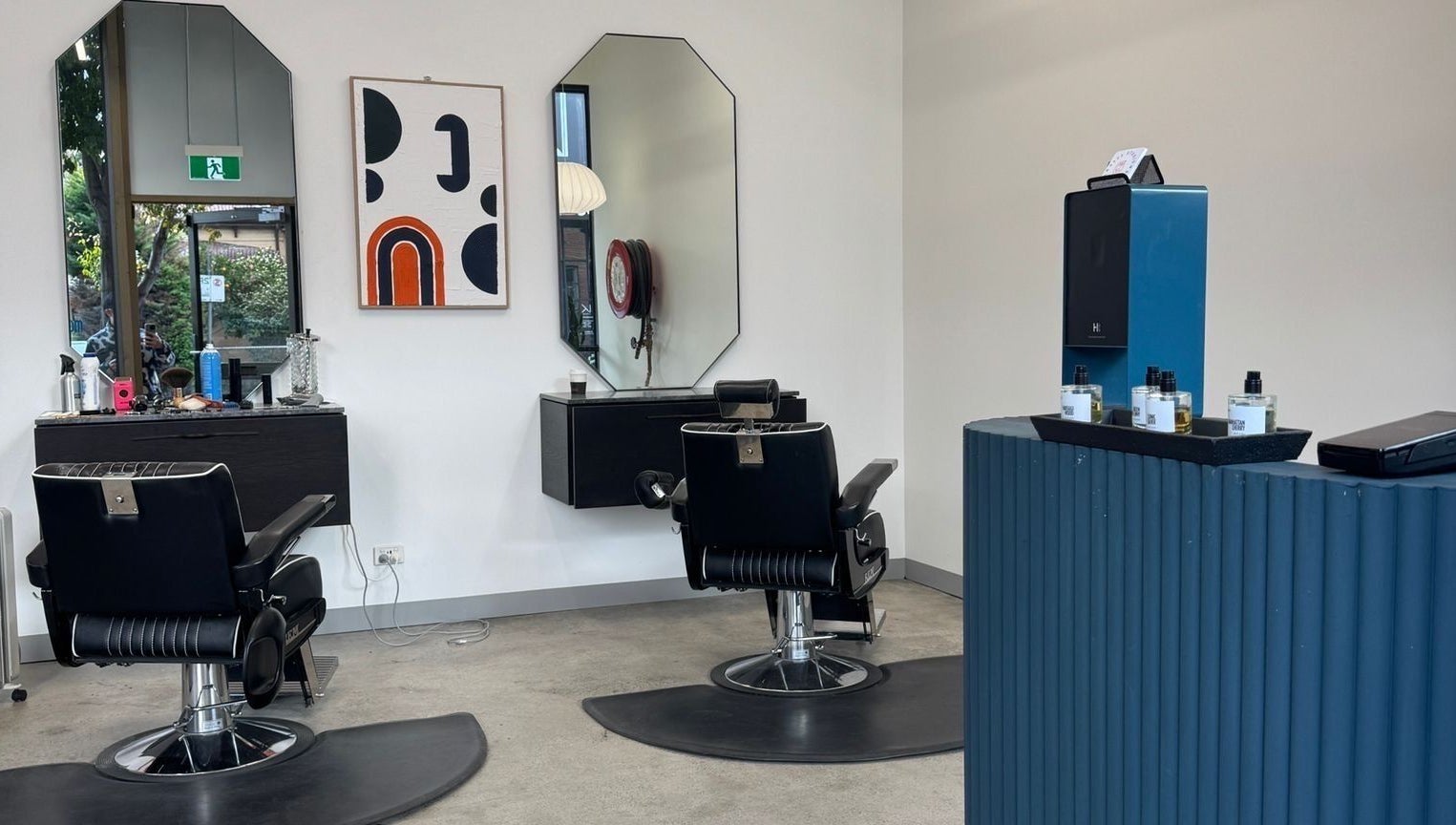 Elegant salon interior at 3121 Studio in Melbourne, Victoria, AU with modern chairs and stylish decor.