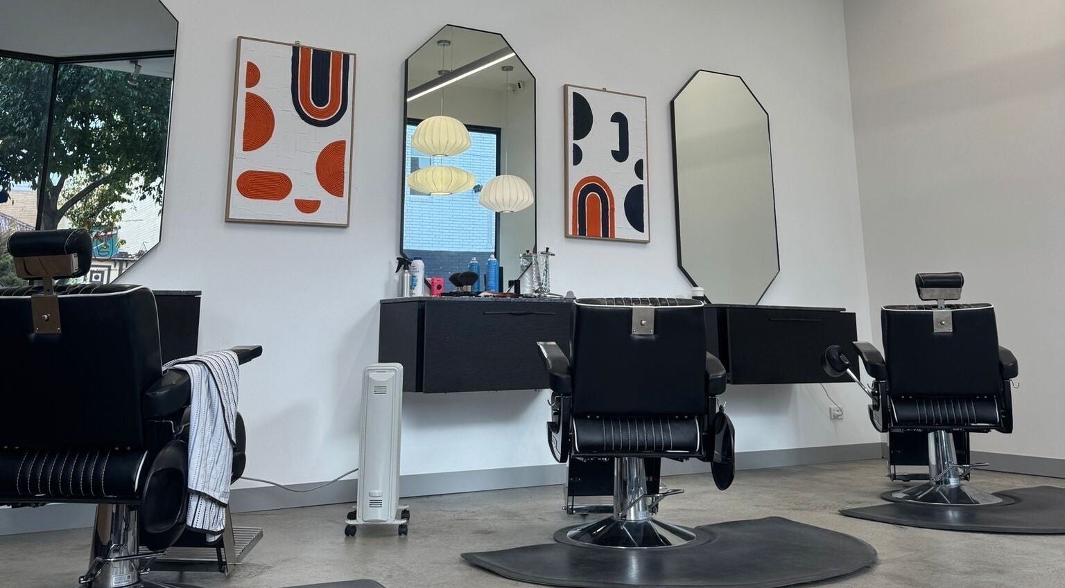 Chic salon chairs and mirrors at 3121 Studio, Melbourne, Victoria, AU, featuring stylish decor and lighting.
