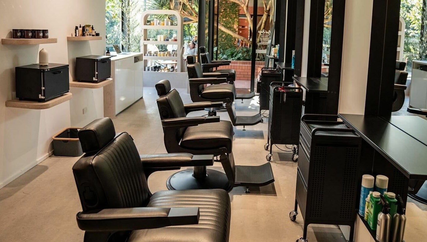 Elegant barber chairs at Lost Boys Tugun, Tugun, Queensland, AU showcasing a modern and inviting salon interior.