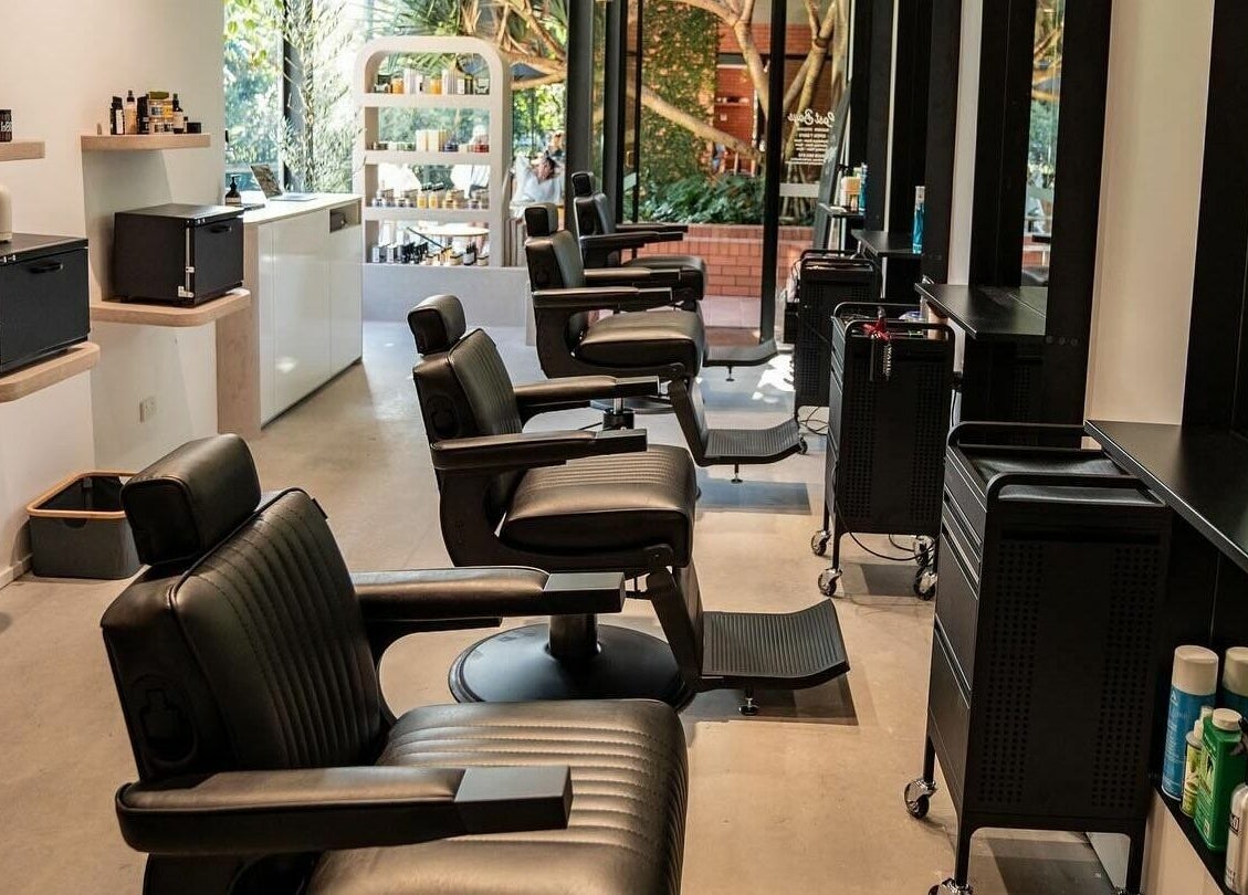 Elegant barber chairs at Lost Boys Tugun, Tugun, Queensland, AU showcasing a modern and inviting salon interior.