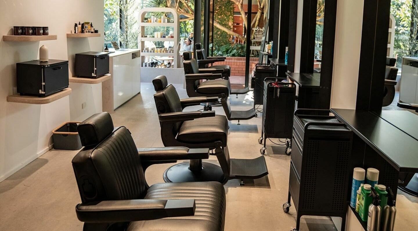 Elegant barber chairs at Lost Boys Tugun, Tugun, Queensland, AU showcasing a modern and inviting salon interior.