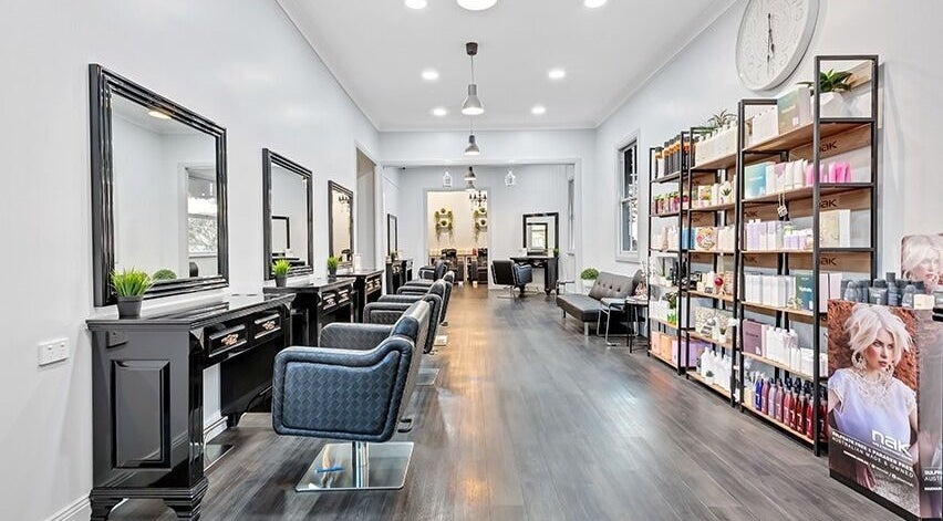 Zigbis Hair & Beauty salon in South Toowoomba, Queensland, AU. Modern chairs, sleek mirrors, elegant design.