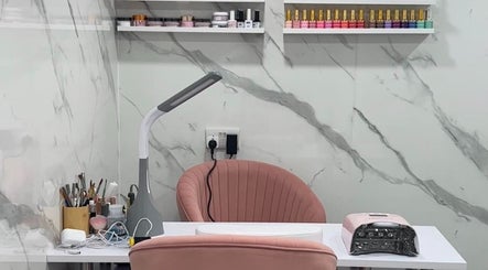 Modern nail station at Star Nail Riddrie, Glasgow, Scotland, GB, featuring sleek design and variety of nail colors.