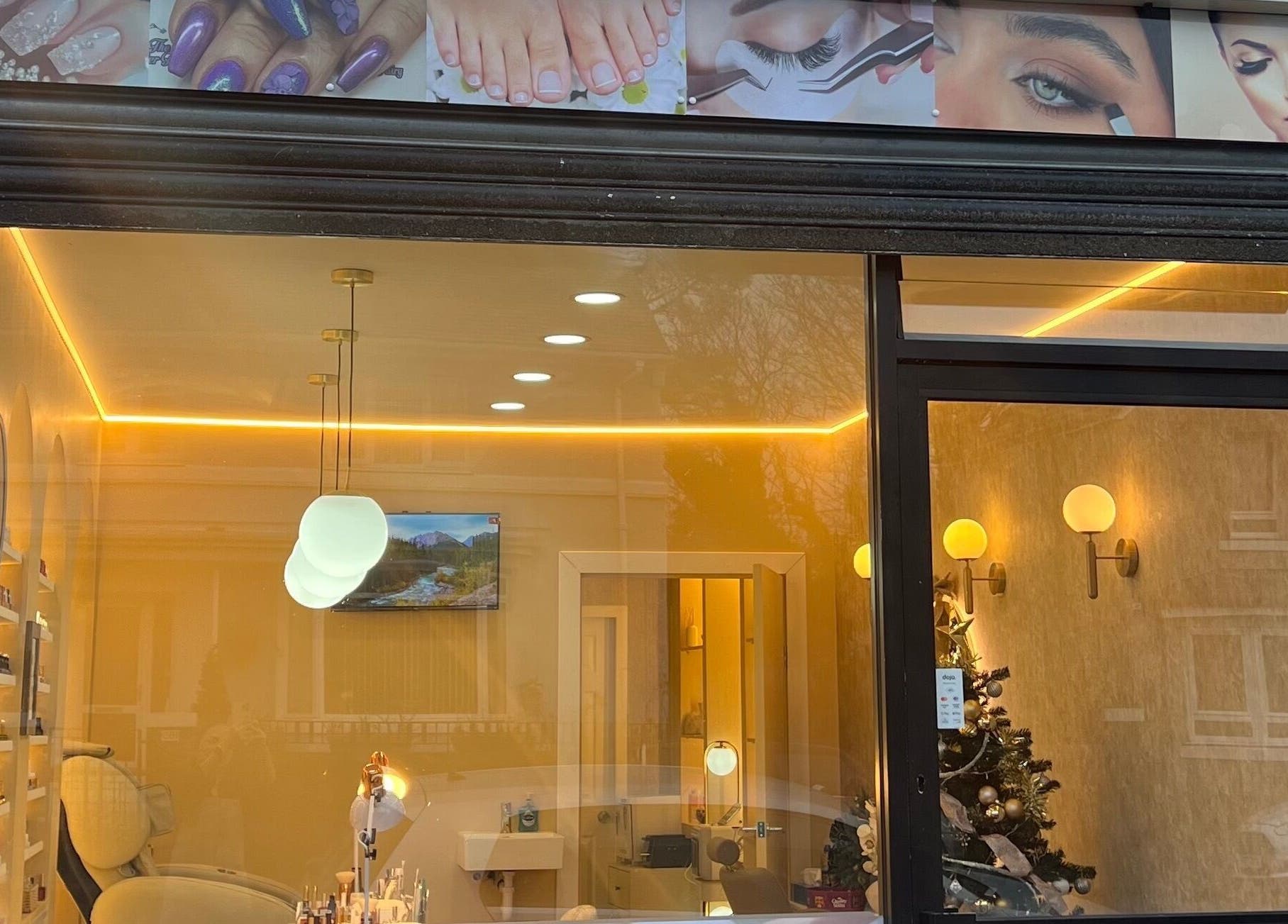 Exterior of Star Nail & Beauty Riddrie in Glasgow, Scotland, GB, showcasing elegant interior lighting.