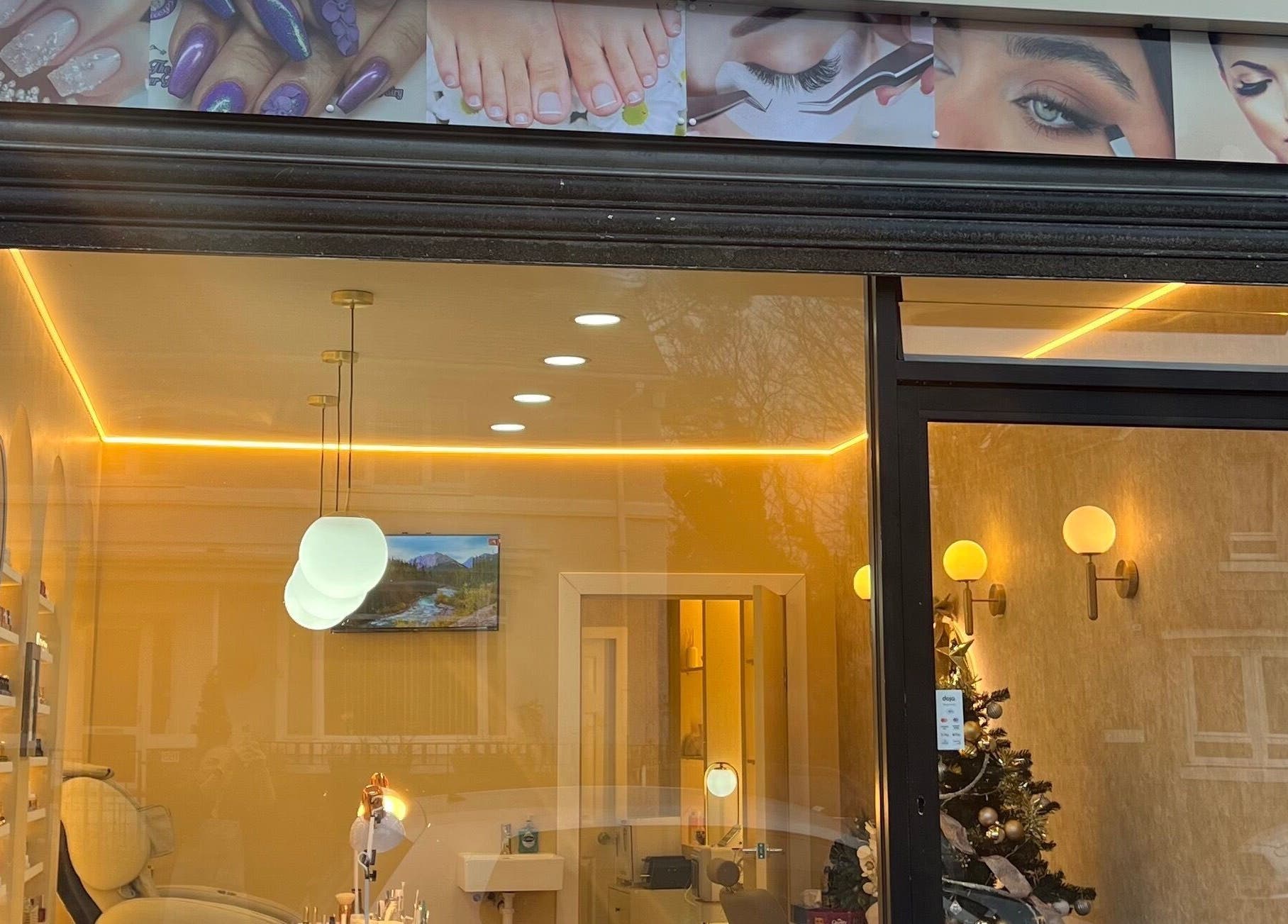 Front view of Star Nail & Beauty Riddrie, Glasgow, Scotland, GB, showing elegant interior lighting and decor.