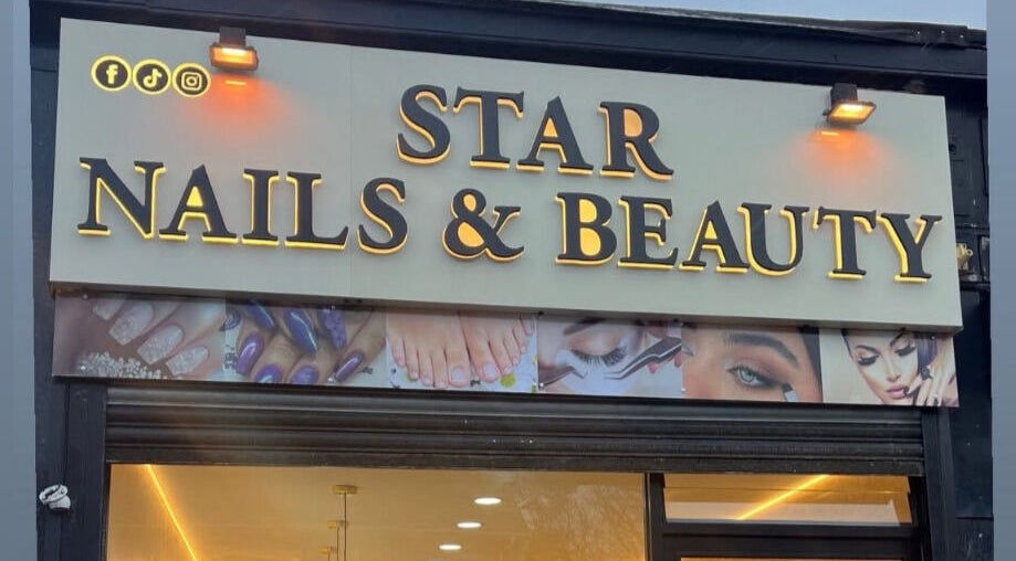 Star Nail & Beauty Riddrie storefront in Glasgow, Scotland, GB with illuminated signage.