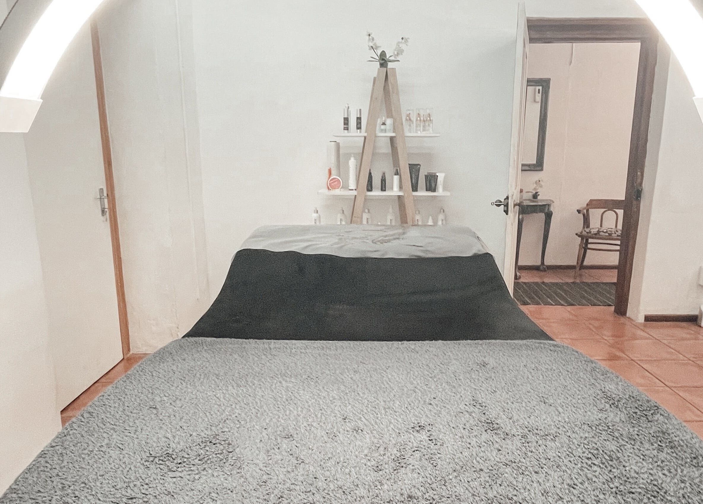 Luxurious treatment room at Winelands Body Aesthetics, Wellington, Western Cape, ZA with calming ambiance.