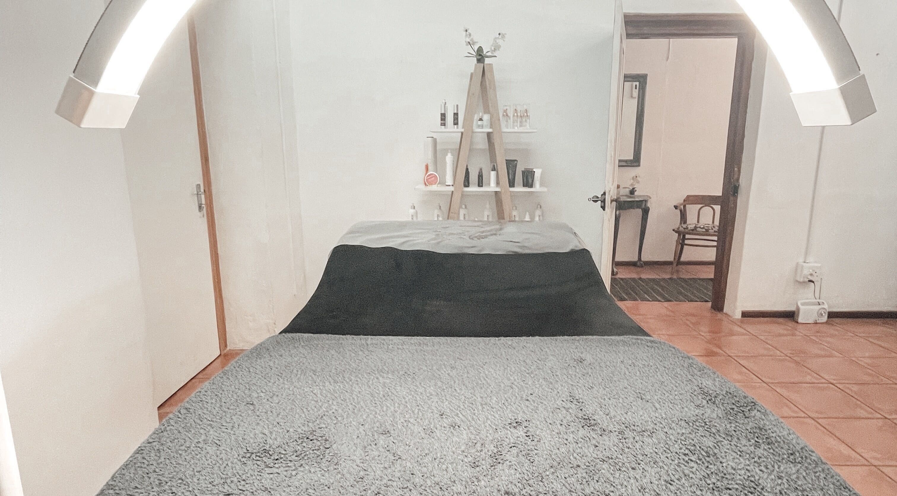 Luxurious treatment room at Winelands Body Aesthetics, Wellington, Western Cape, ZA with calming ambiance.