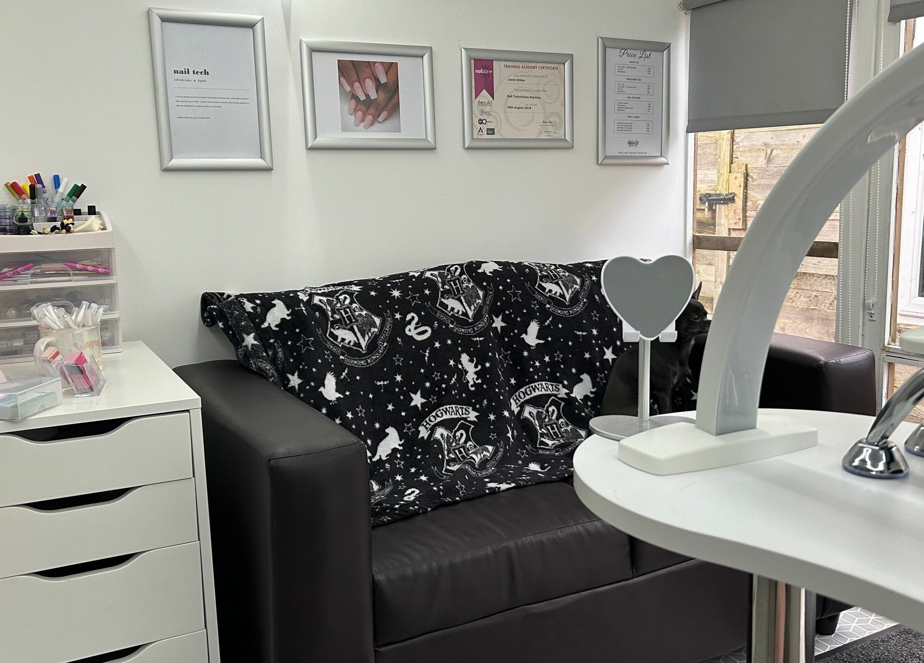 Cozy nail salon lounge at Nailed it! in Sauchie, Scotland, GB with stylish decor and nail art displays.