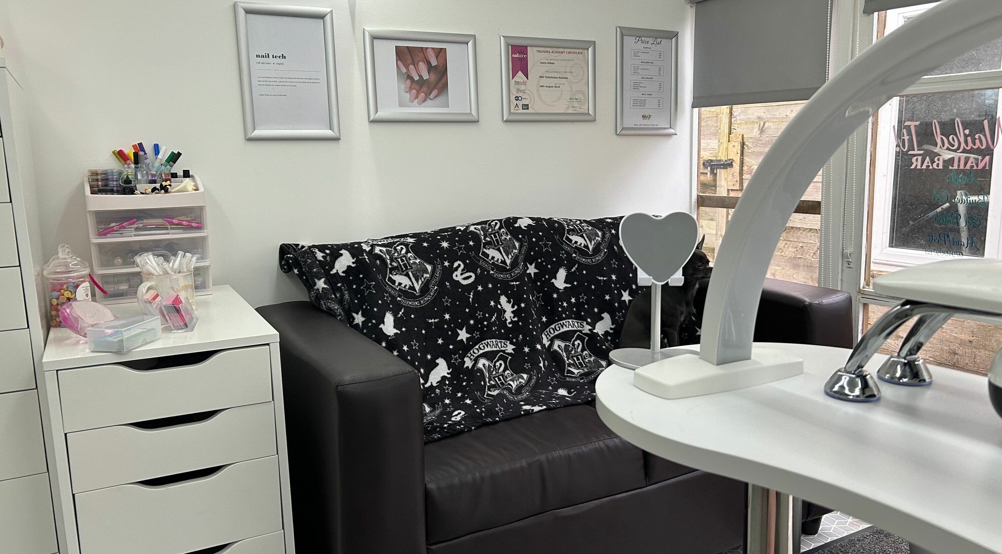 Cozy nail salon lounge at Nailed it! in Sauchie, Scotland, GB with stylish decor and nail art displays.