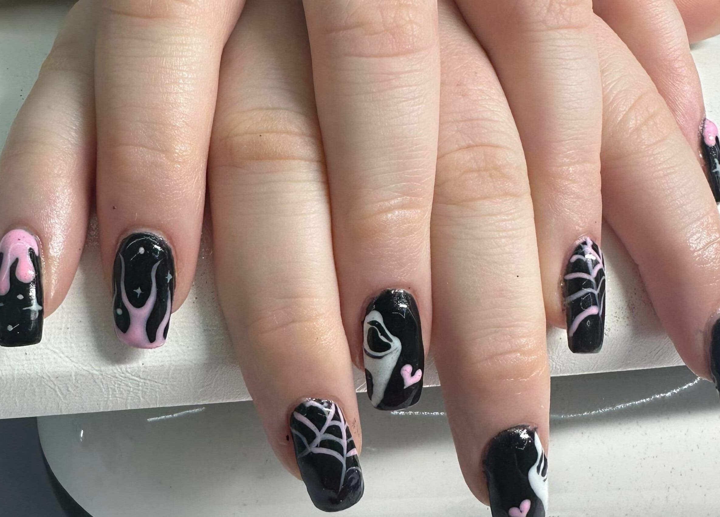 Intricate black and pink nail art at Nailed it! in Sauchie, Scotland, GB showcasing unique gothic designs.