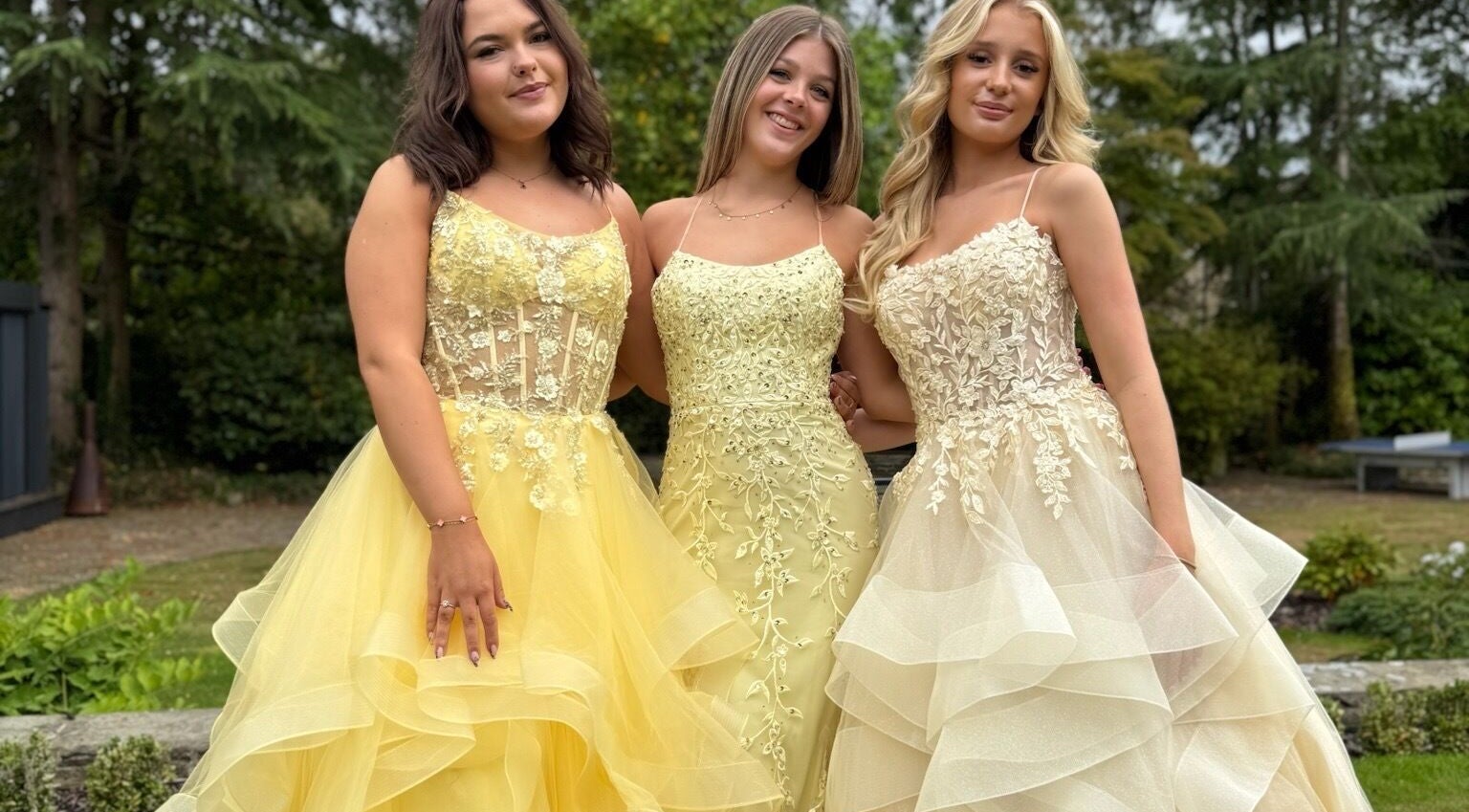 Three women in elegant gowns at The Prom Den - Horsforth, Horsforth, England, GB, showcasing prom fashion.