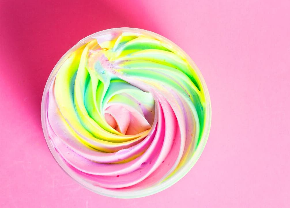 Colorful rainbow swirl in a jar from Essentials by L.T, Midrand, Gauteng, ZA, perfect for vibrant skincare.