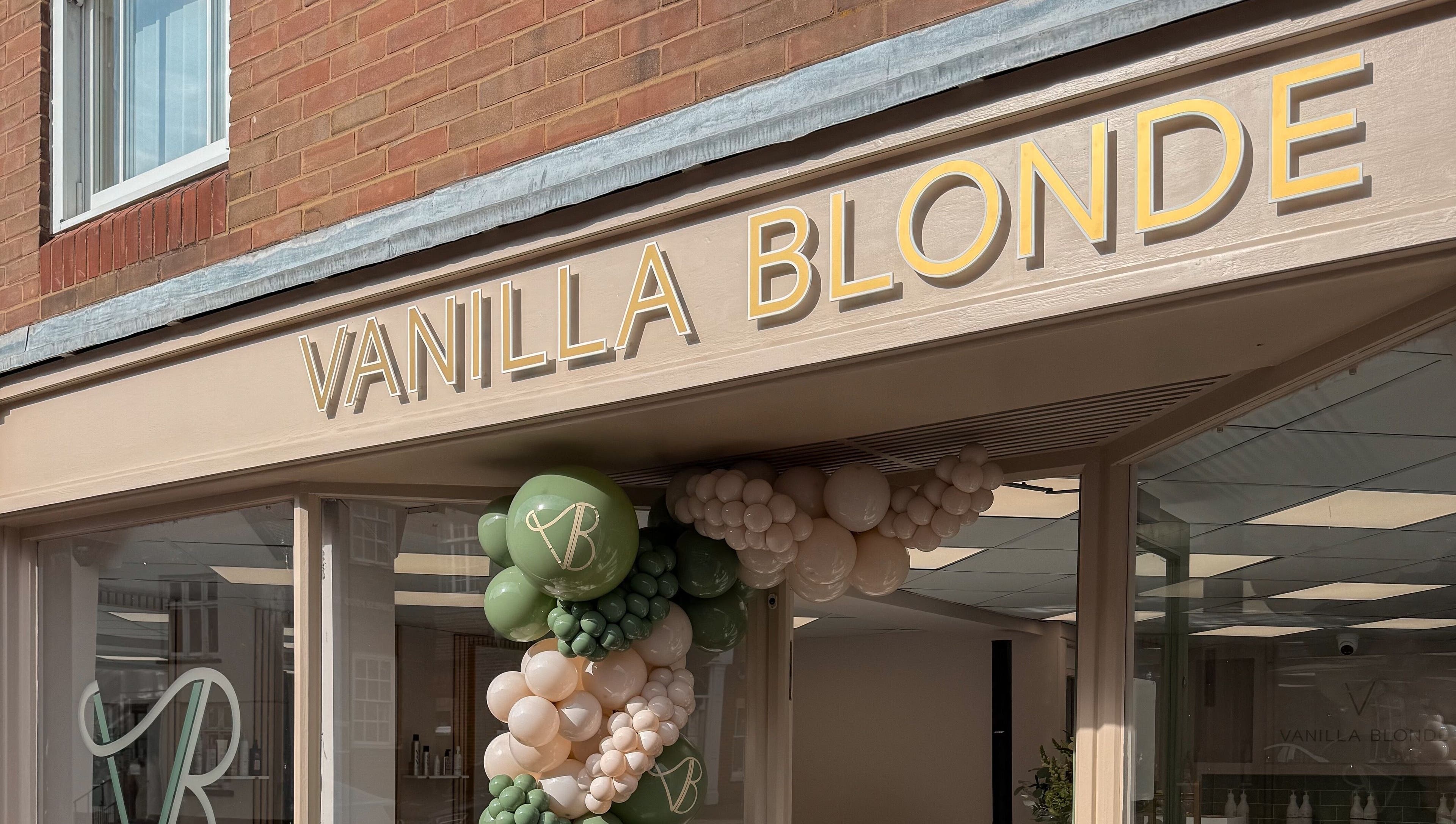 Entrance of Vanilla Blonde in Witham, England, GB, featuring stylish signage and decorative balloons.