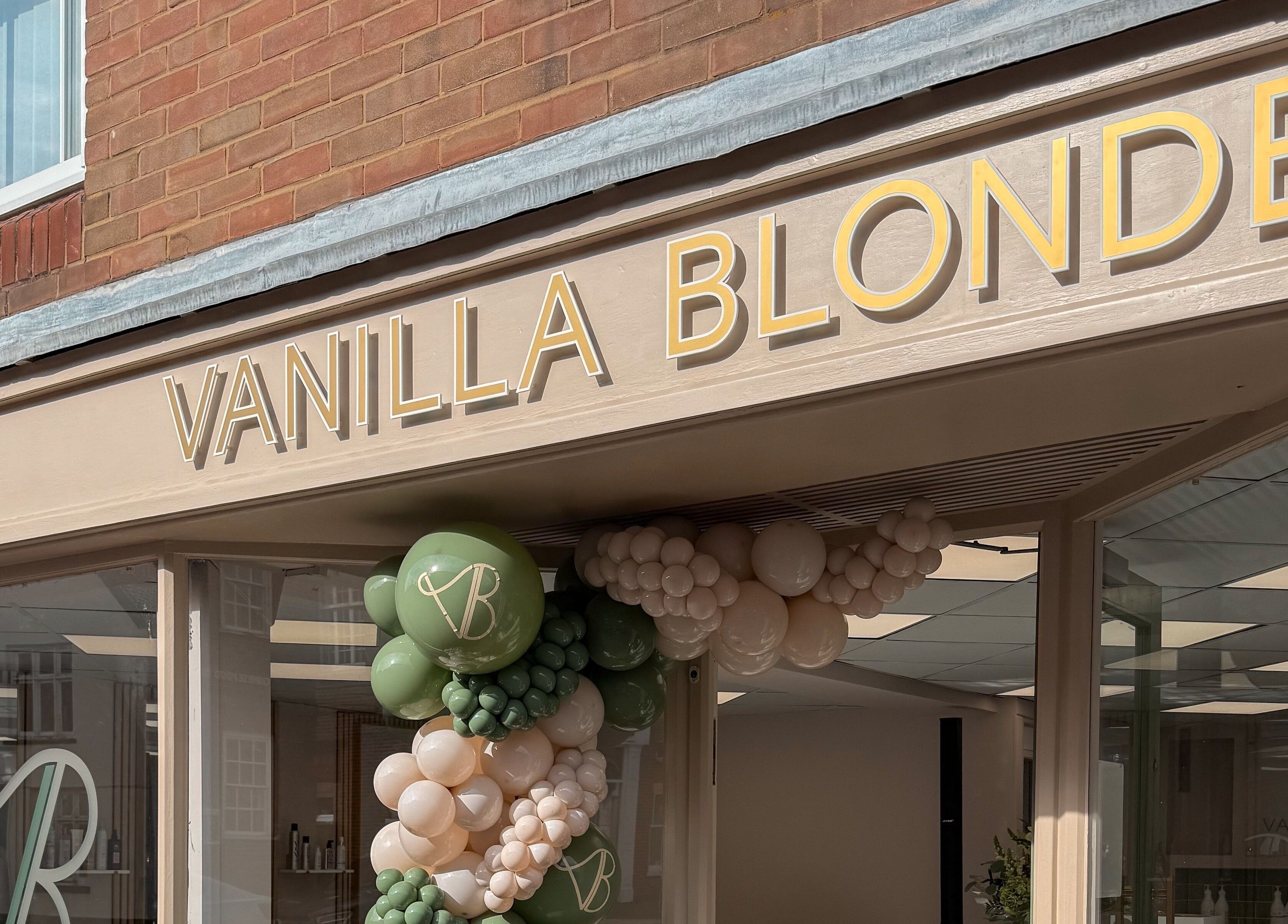 Entrance of Vanilla Blonde in Witham, England, GB, featuring stylish signage and decorative balloons.