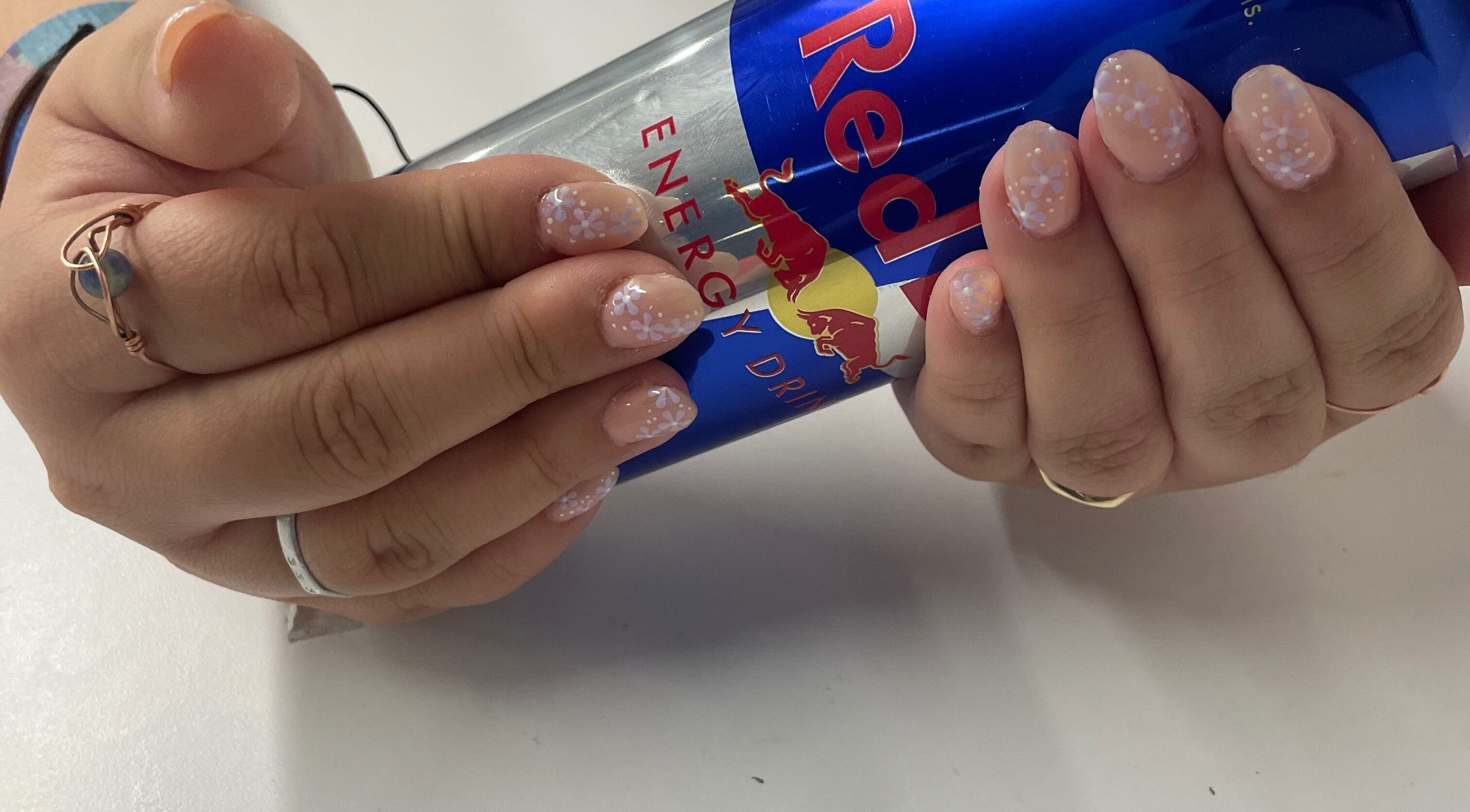 Delicate floral nail art at Jeweled by Jules, Ottawa, Ontario, CA.