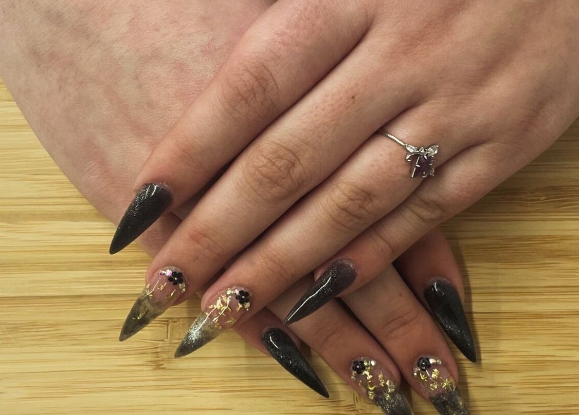 Stylish nail art with glitter at Jeweled by Jules, Ottawa, Ontario, CA. Perfect for glamorous occasions.
