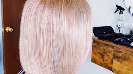 Shiny blonde hair at Southern Siren Studio in Jacksonville, Florida, US, styled in a sleek bob cut.