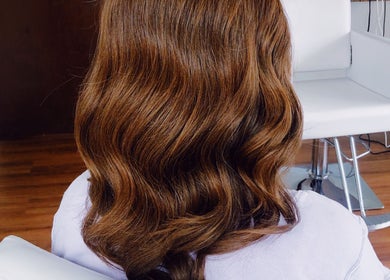 Gorgeous wavy brown hairstyle at Southern Siren Studio in Jacksonville, Florida, US.